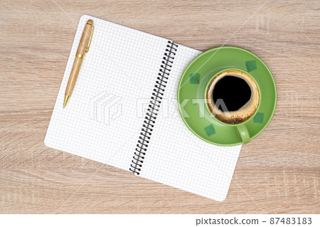 Coffee cup, spiral notebook and pen on the wooden table Coffee cup, spiral notebook and pen on the wooden table 87483183
