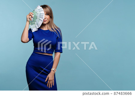 Woman with fan paper money cash 87483666