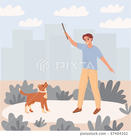 A young man plays with a dog in nature near the buildings of the city. The guy holds a stick in his hand and smiles. Illustration of friendship with a pet. 87484102