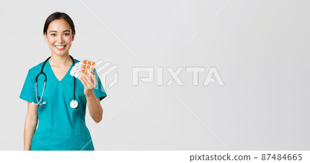 Healthcare workers, preventing virus, quarantine campaign concept. Friendly-looking female asian nurse, doctor explain patient medication prescription, showing drugs and smiling, white background Healthcare workers, preventing virus, quarantine campaign concept. Friendly-looking female asian nurse, doctor explain patient medication prescription, showing drugs and smiling, white background 87484665