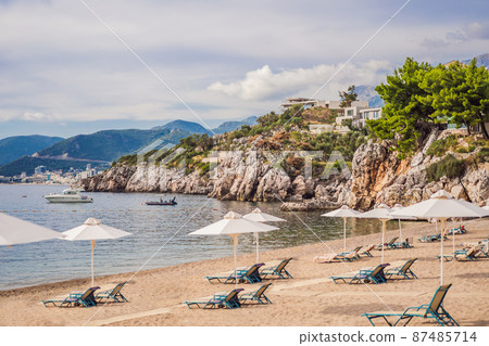 Picturesque summer view of Adriatic sea coast in Budva Riviera near Przno village. Cozy beach and buildings on the rock. Location: Przno village, Montenegro, Balkans, Europe 87485714