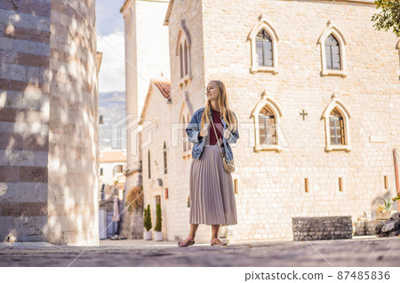 Young woman tourist in the old town of Budva. Travel to Montenegro concept 87485836