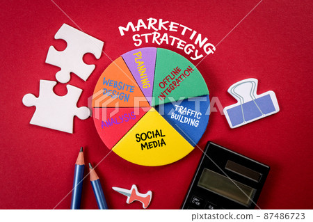 Marketing Strategy concept. Analysis and planning, office items on a red background Marketing Strategy concept. Analysis and planning, office items on a red background 87486723