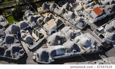 Famous Trulli houses in the city of Alberobello in Italy 87487626