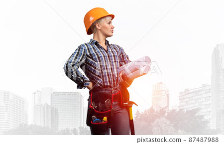 Attractive female engineer in hardhat Attractive female engineer in hardhat 87487988