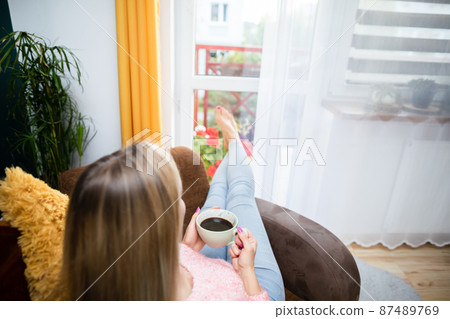 Relax with an aromatic coffee after a hard day at work. Relax with an aromatic coffee after a hard day at work. 87489769