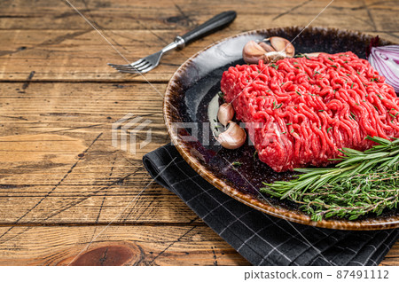 Raw Mince, minced Ground beef and lamb meat. Wooden background. Top view. Copy space 87491112