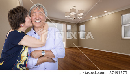 Two Affectionate Chinese Senior Adults In New Empty Room of House. 87491775