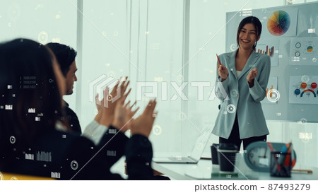 Business people in corporate staff meeting with envisional graphic 87493279