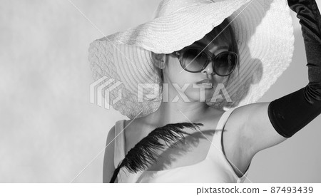 Half body Asian Woman 20s wear Bikini sunglasses beach hat and gloves stay in sun and reflect 87493439