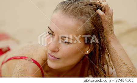 Sexy view at the beach - skin covered with sand Sexy view at the beach - skin covered with sand 87494163