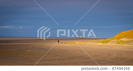 The beach and Wadden Sea of St Peter Ording in Germany is a popular tourist attraction 87494168