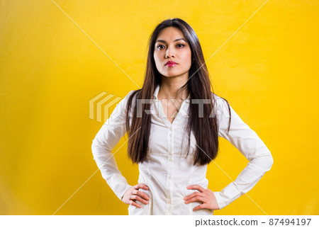 Young self-confident woman in a studio Young self-confident woman in a studio 87494197
