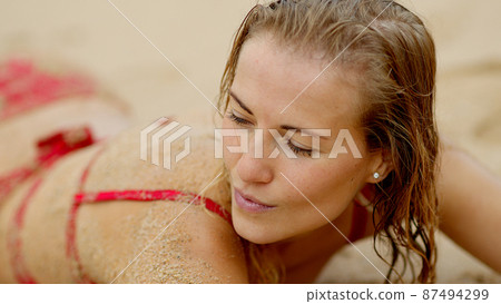Young and sexy woman at the beach Young and sexy woman at the beach 87494299