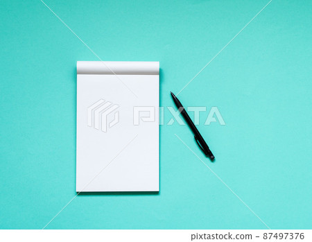 open notepad with a clean white page 87497376