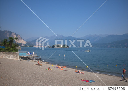 The beach on the lake shore, Stresa, Lombardy, Italy. The beach on the lake shore, Stresa, Lombardy, Italy. 87498308