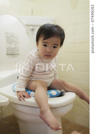 Small child doing potty training Small child doing potty training 87499262