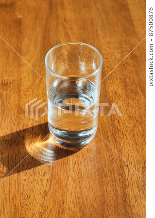 A cup of water placed on the table A cup of water placed on the table 87500876