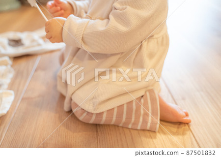 Baby playing with children's toys 87501832