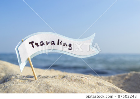 Empty blue white blank speech bubble on wooden stick on sandy sea beach close-up Empty blue white blank speech bubble on wooden stick on sandy sea beach close-up 87502248