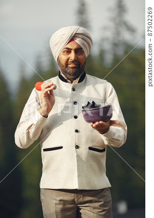 Portrait of Indian sikh man in turban with bushy beard Portrait of Indian sikh man in turban with bushy beard 87502269