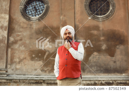 Portrait of Indian sikh man in turban with bushy beard 87502349