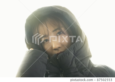 Woman wearing a down 87502553