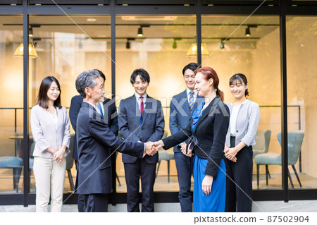 Business person with a global contract 87502904