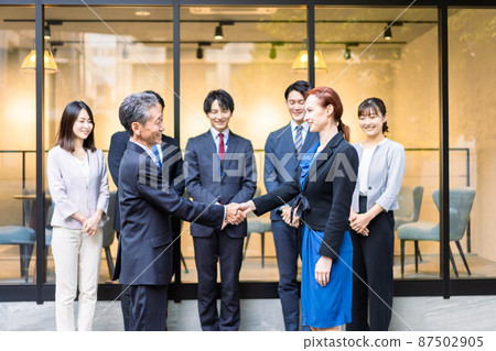 Business person with a global contract 87502905