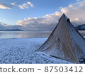Camping and tents in winter snow 87503412