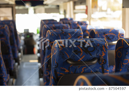 Interior of bus. Seating in transport. Seats for passengers. Interior of bus. Seating in transport. Seats for passengers. 87504597