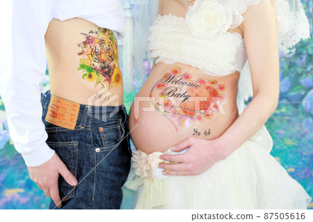 Maternity photo, pregnant woman and husband's stomach up Maternity photo, pregnant woman and husband's stomach up 87505616