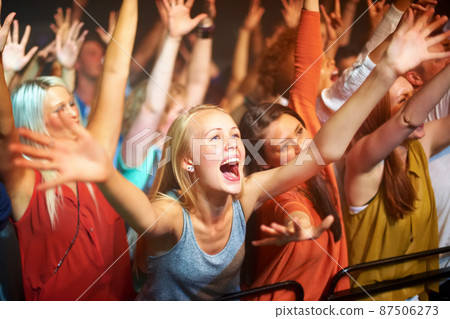 Caught up in the vibe. A huge group of fans screaming at a rock concert. Caught up in the vibe. A huge group of fans screaming at a rock concert. 87506273