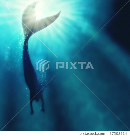 A silhouette shot of a mermaid swimming in solitude in the deep blue sea - ALL design on this image is created from scratch by Yuri Arcurs team of professionals for this particular photo shoot 87508314