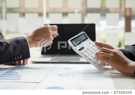 Business leaders talk about charts, financial graphs showing results are analyzing and calculating planning strategies, business success building processes Business leaders talk about charts, financial graphs showing results are analyzing and calculating planning strategies, business success building processes 87509109