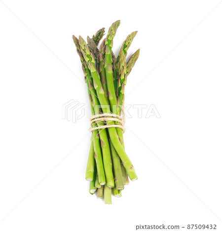 Delicious green spears. High angle shot of a bundle of green asparagus against a white background. 87509432