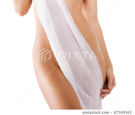 Her femininity speaks for itself. Studio shot of a beautiful woman with a sarong draped over her body against a white background. 87509561