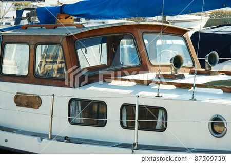 A sturdy craft. Close up of an old wooden sailing boat. A sturdy craft. Close up of an old wooden sailing boat. 87509739