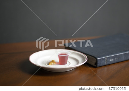 Holy Communion wine and bread with Holy Bible. 87510035