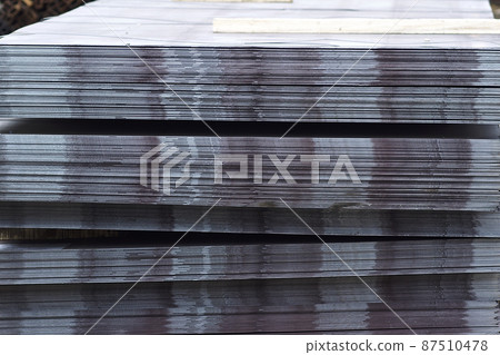 Sheet metal is in bundles in the warehouse Sheet metal is in bundles in the warehouse 87510478