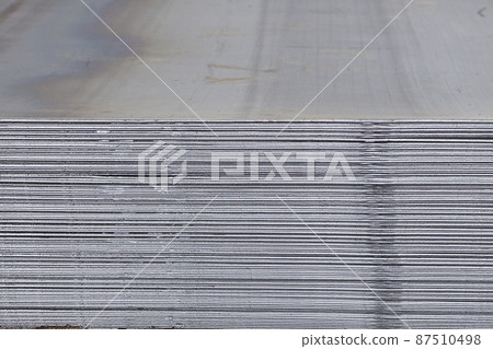 Sheet metal is in bundles in the warehouse Sheet metal is in bundles in the warehouse 87510498