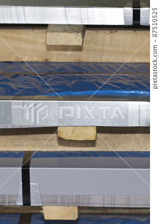 Sheet metal is in bundles in the warehouse 87510525