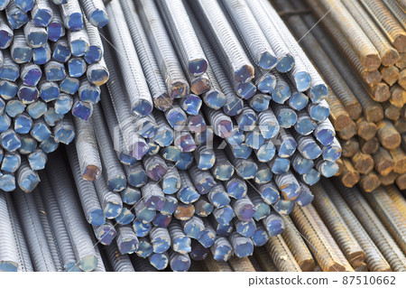 Reinforcing bars with a periodic profile in the packs are stored in the metal products warehouse Reinforcing bars with a periodic profile in the packs are stored in the metal products warehouse 87510662