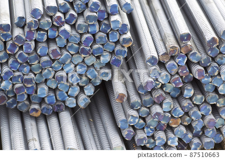 Reinforcing bars with a periodic profile in the packs are stored in the metal products warehouse Reinforcing bars with a periodic profile in the packs are stored in the metal products warehouse 87510663