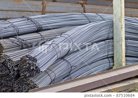 Reinforcing bars with a periodic profile in the packs are stored in the metal products warehouse Reinforcing bars with a periodic profile in the packs are stored in the metal products warehouse 87510684