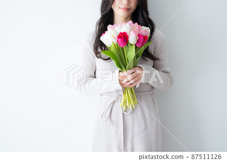Woman with tulips Woman with tulips 87511126