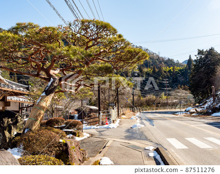 Scenery of Tsumago-juku in winter, sunny in February, quaint cityscape entrance Scenery of Tsumago-juku in winter, sunny in February, quaint cityscape entrance 87511276