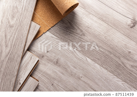 Laminate wood floor with cork background texture. Wooden laminate floor Laminate wood floor with cork background texture. Wooden laminate floor 87511439