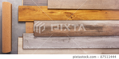 Laminate wood floor with cork background texture. Wooden laminate floor 87511444