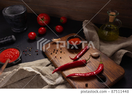 Chile pepper and tomato sauce ingredient for homemade cooking on table. Recipe concept Chile pepper and tomato sauce ingredient for homemade cooking on table. Recipe concept 87511448
